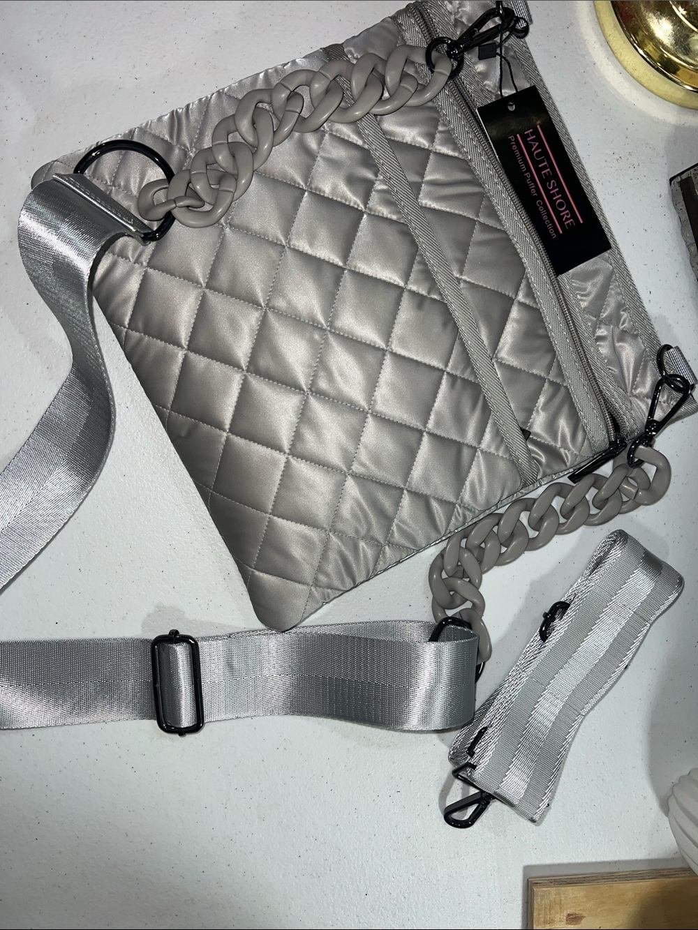 Haute Shore Dani Beam Crossbody Bag in the "Beam" (Light Gray)